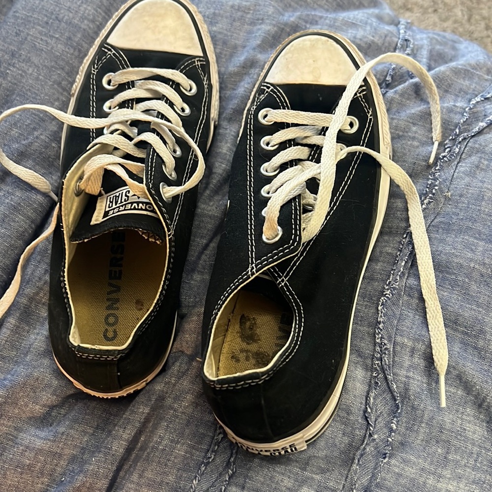 Black all star converse . worn . lots of wear left . in good condition.